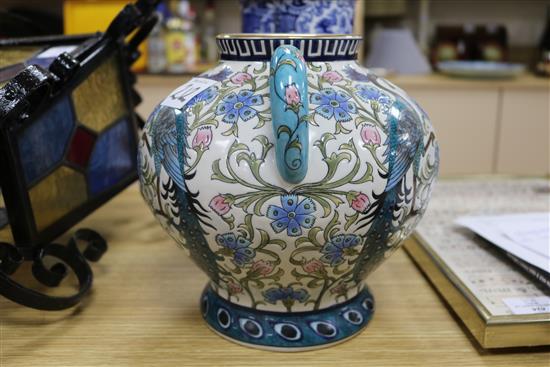 A modern Persian style two handled vase and a pair of blue and white sleeve vases